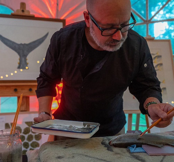 Gyotaku artist Nate Garrett demonstrates his craft at the Japan Society of Boston's annual gala